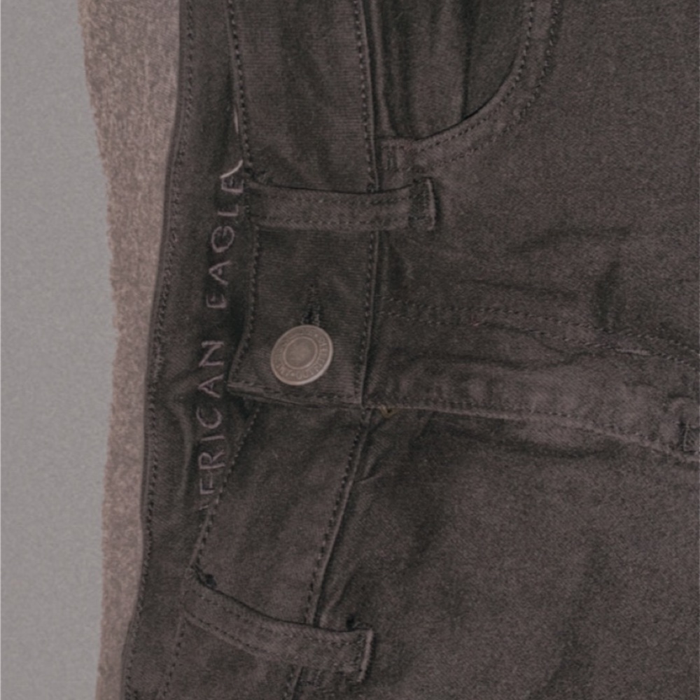 American Eagle jeans with two rips in the knees